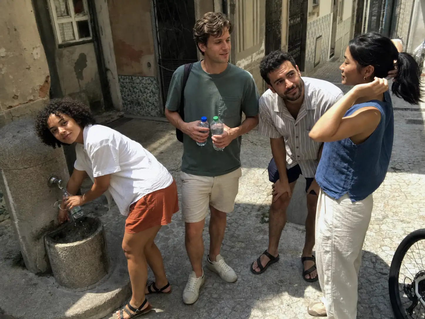 Friends taking a break during a hot walk through the old town